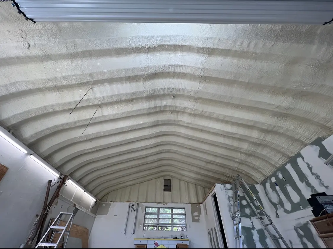 Spray polyurethane foam applied to the underside of a metal roof deck in Bay St. Louis